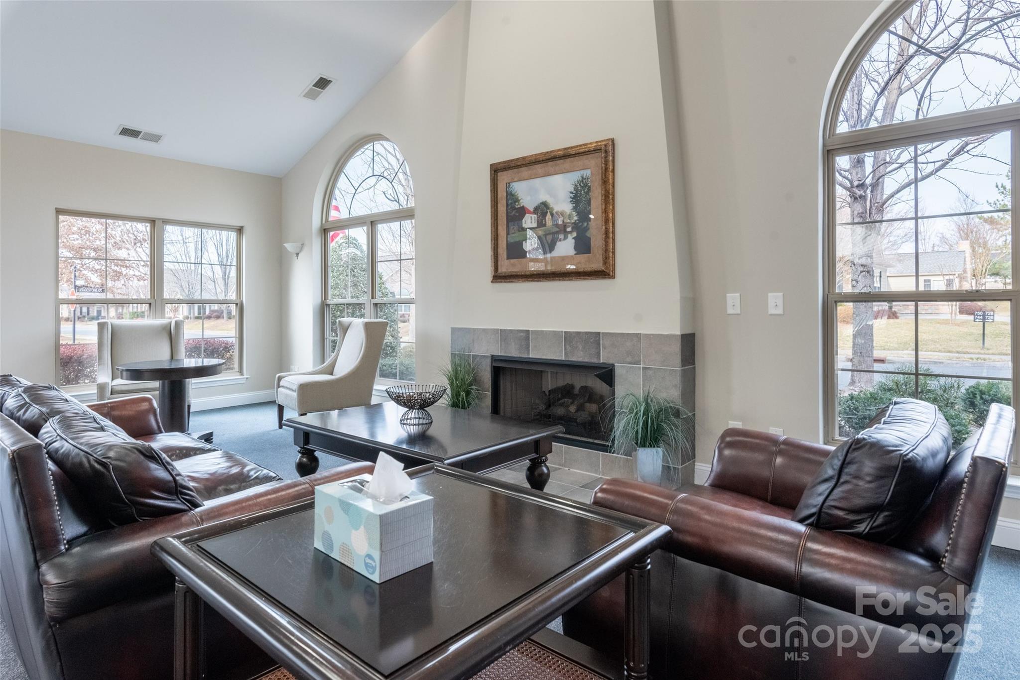 874 Ledgestone Court Tega Cay, SC 29708 - Photo 35 of 38 a living room with furniture fireplace and a large window