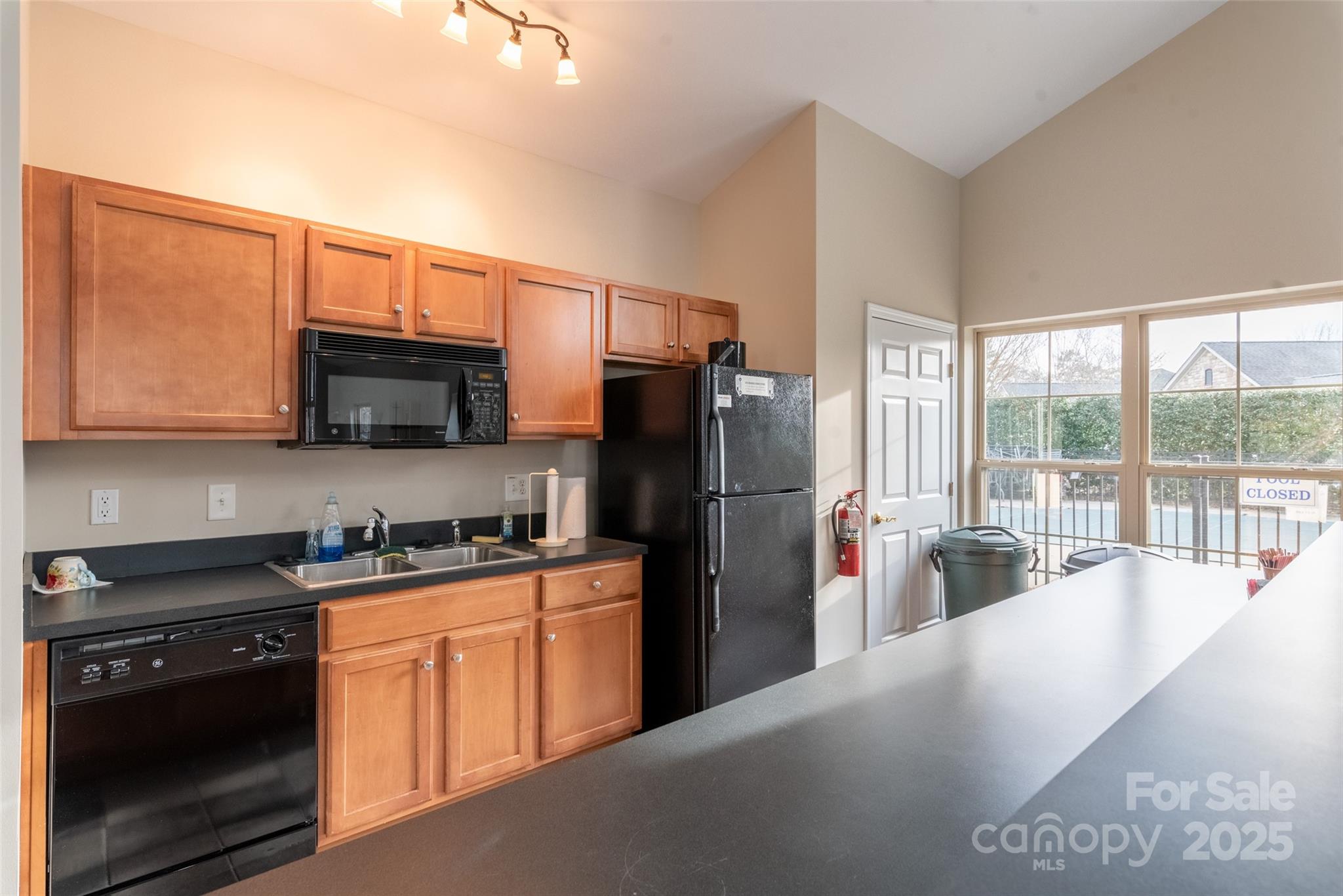 874 Ledgestone Court Tega Cay, SC 29708 - Photo 36 of 38 a kitchen with stainless steel appliances granite countertop a refrigerator stove and sink
