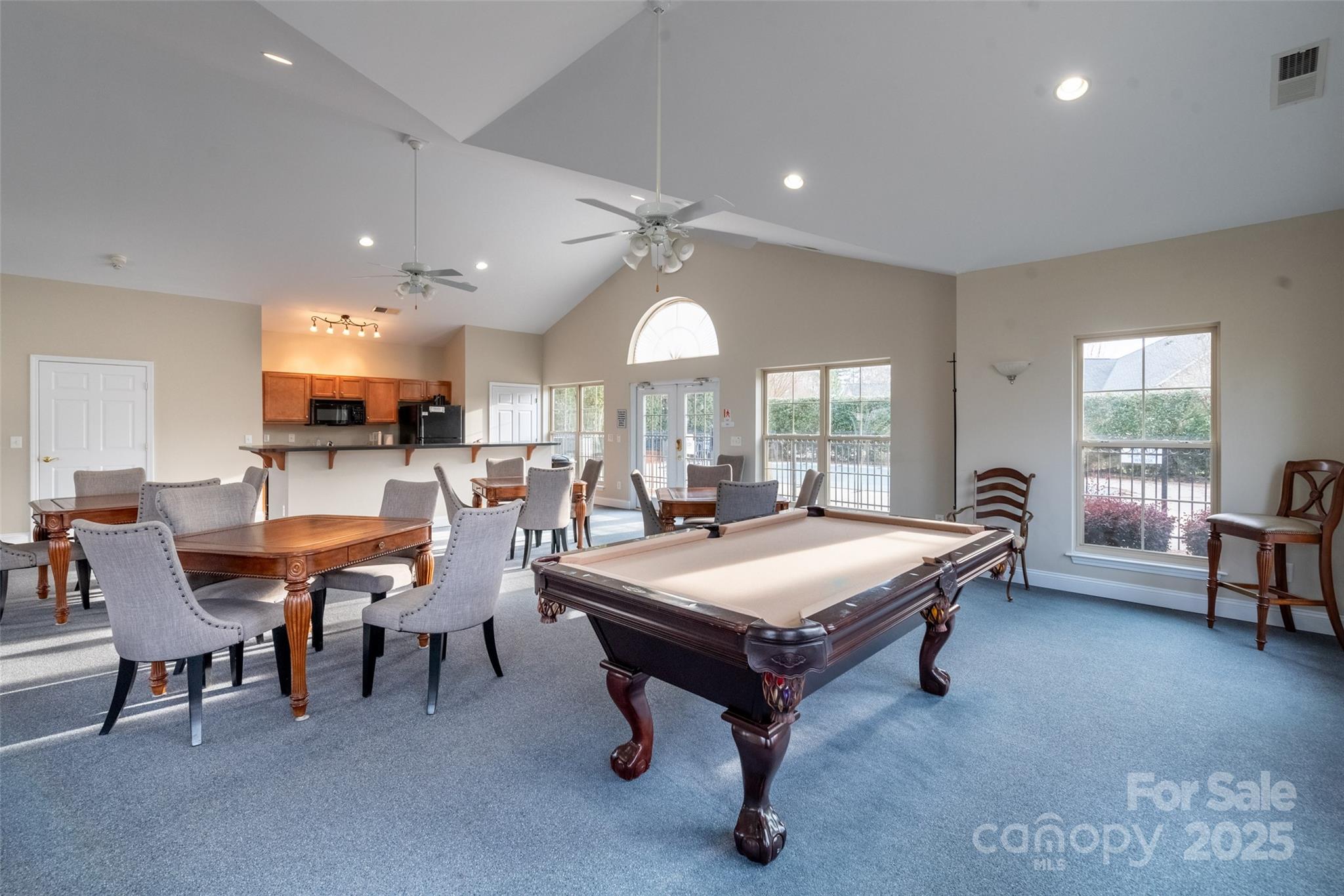 874 Ledgestone Court Tega Cay, SC 29708 - Photo 38 of 38 a room with furniture a table and a large window