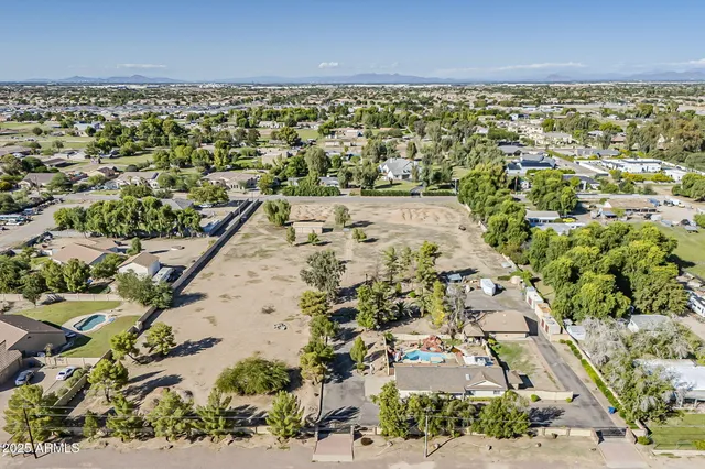 an aerial view of residential building and parking space