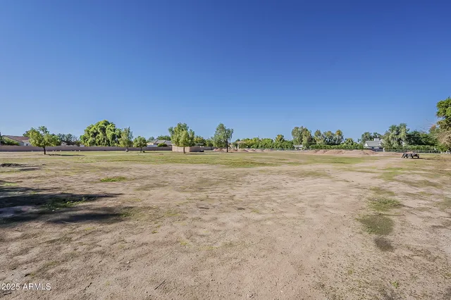 an aerial view of residential houses with outdoor space and street view