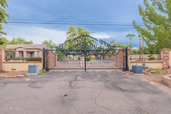 a front view of a house with a yard and a garage