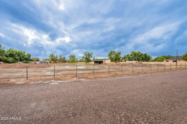 a view of a road with a big yard