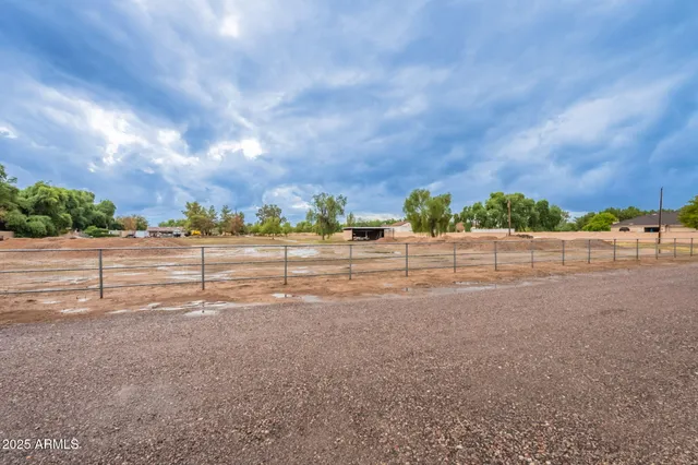 a view of a road with a big yard