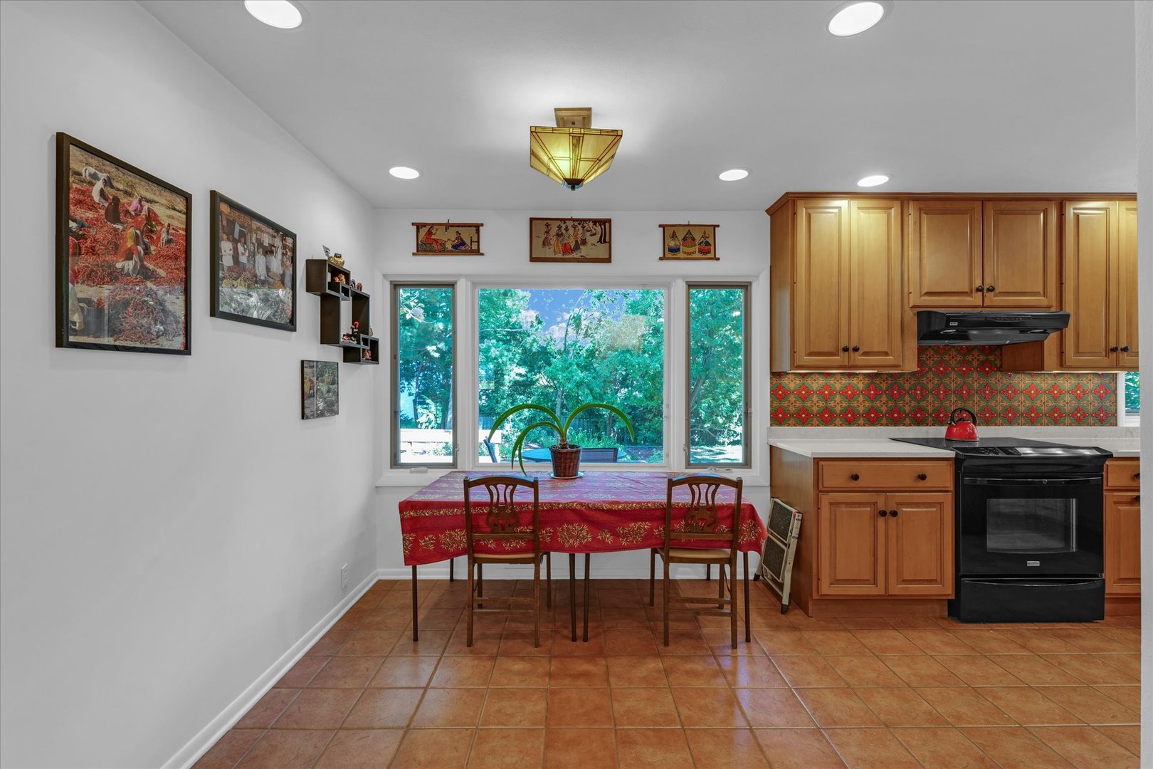 1505 Alma Drive Champaign, IL 61820 - Photo 15 of 50 a kitchen with stainless steel appliances granite countertop a stove a sink and a refrigerator
