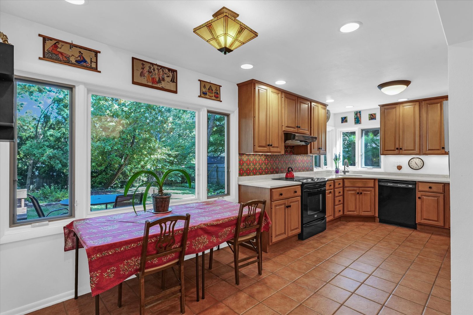 1505 Alma Drive Champaign, IL 61820 - Photo 16 of 50 a kitchen with a table chairs sink and cabinets