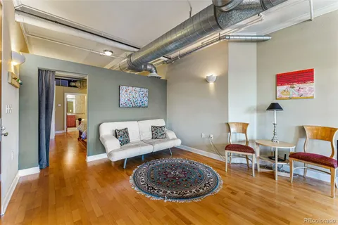 a living room with furniture and a rug