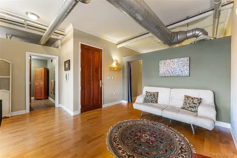 a living room with furniture and a rug
