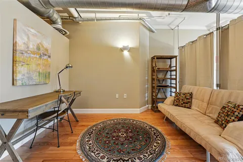 a living room with furniture and a rug
