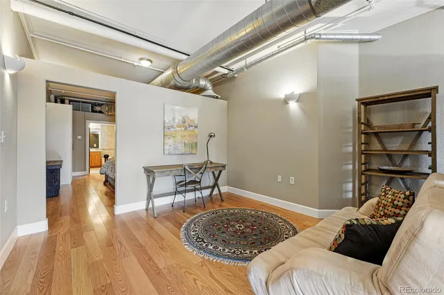 a bedroom with a bed and a table with chair