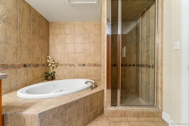 a bathroom with a tub and shower