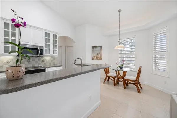 a dining room with furniture and window