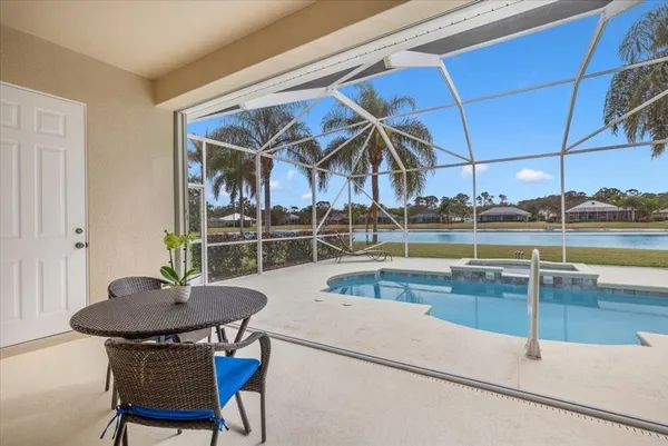 a view of a dining room with furniture and window