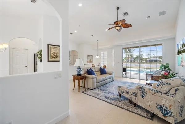 a living room with furniture and a large window