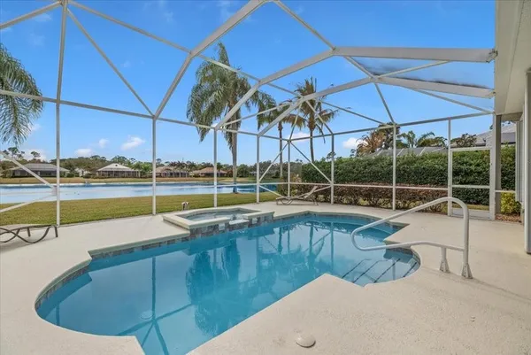 a view of a swimming pool with a patio