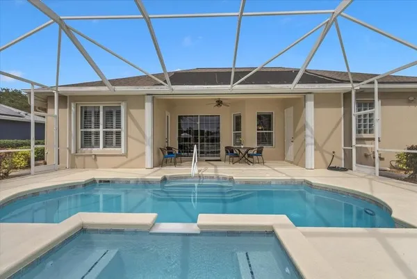 an outdoor view of house with swimming pool