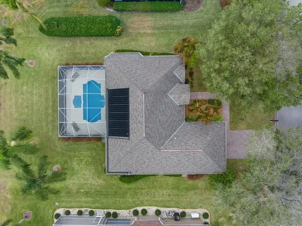 an aerial view of a house with a garden