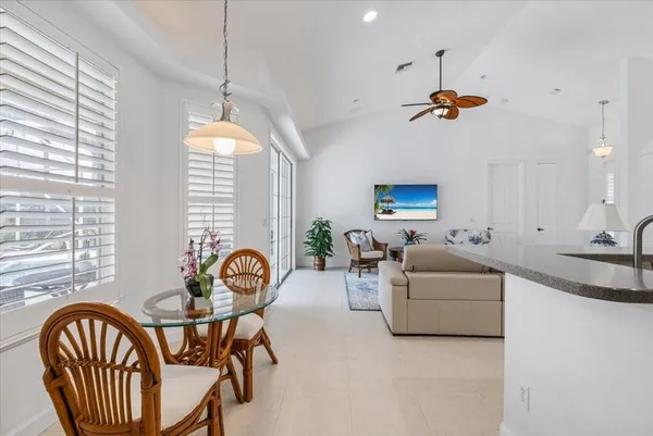 a view of a livingroom with furniture and windows