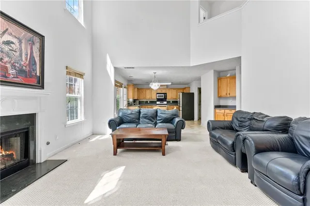 a living room with furniture window and fireplace