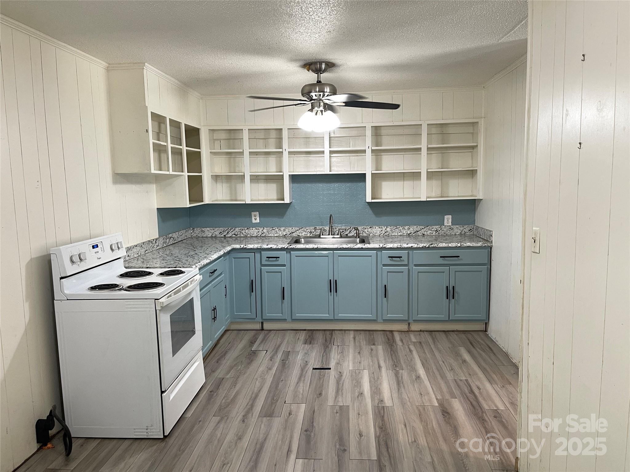 28 Maiden Lane York, SC 29745 - Photo 6 of 22 a kitchen with a stove top oven sink and cabinets
