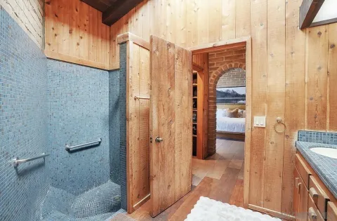 a bathroom with a shower and a sink