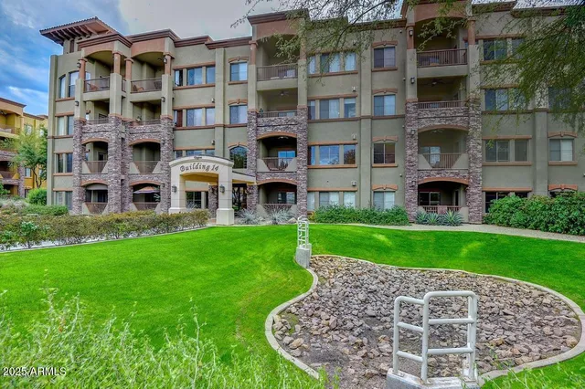 a sign that is in front of flowers