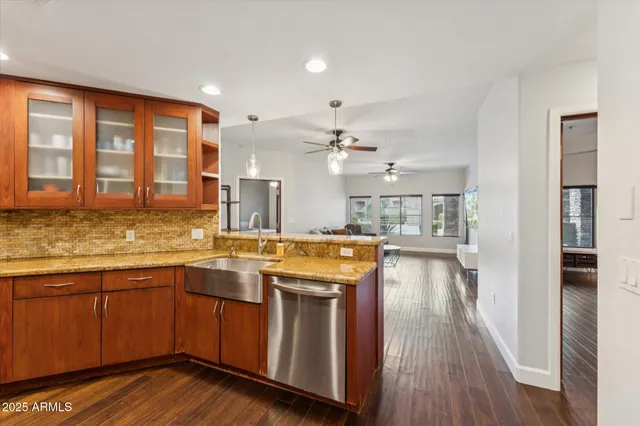 a kitchen with a sink and wooden cabinets