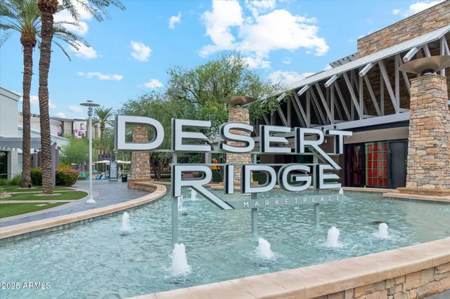 a sign that is sitting in front of a house