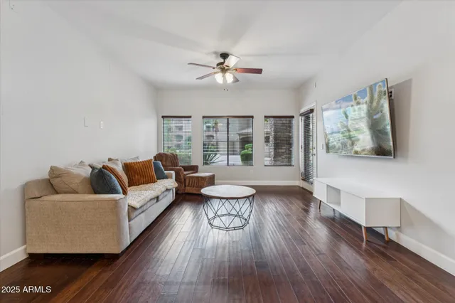 a living room with furniture and a large window