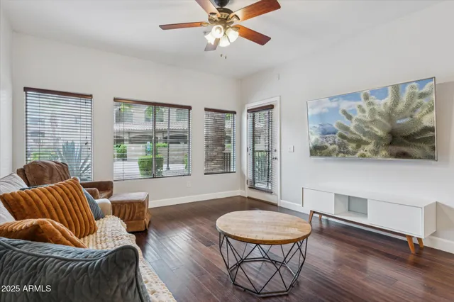 a living room with furniture and a large window