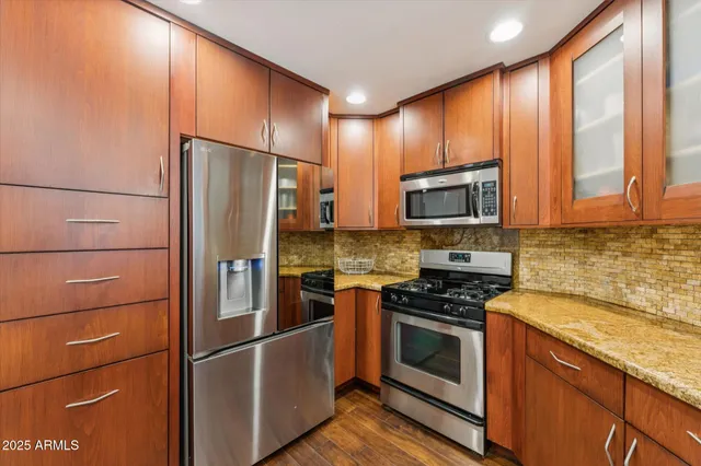 a kitchen with a refrigerator stove and microwave