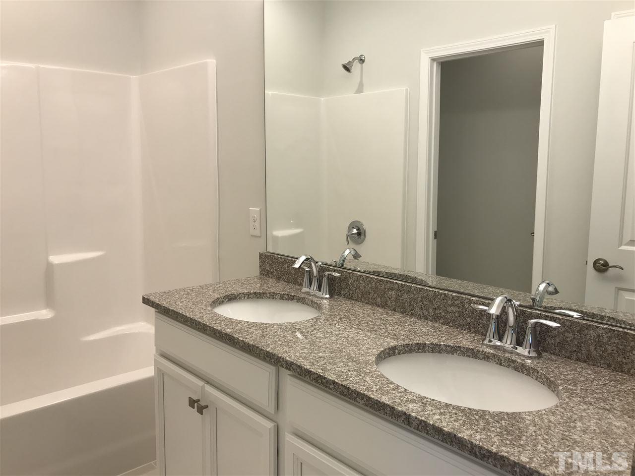 2506 Rambling Creek Road, Unit 32 Apex, NC 27523 - Photo 14 of 30 Hall bathroom with 2 sinks