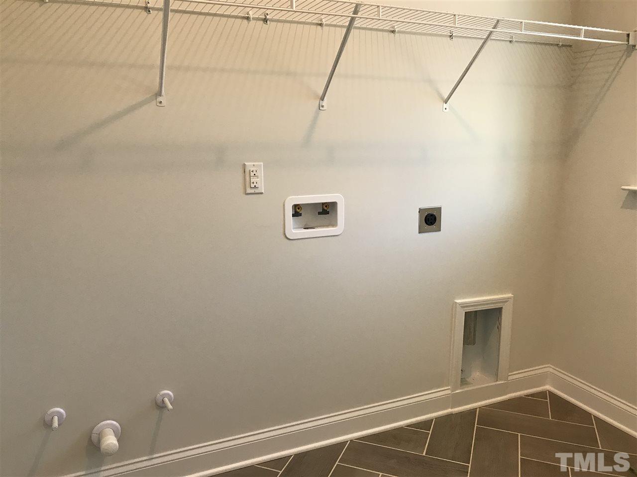 2506 Rambling Creek Road, Unit 32 Apex, NC 27523 - Photo 22 of 30 Laundry room with ceramic tile floor