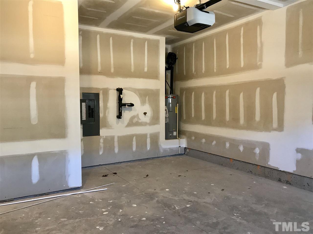 2506 Rambling Creek Road, Unit 32 Apex, NC 27523 - Photo 27 of 30 Garage with extra storage in the back