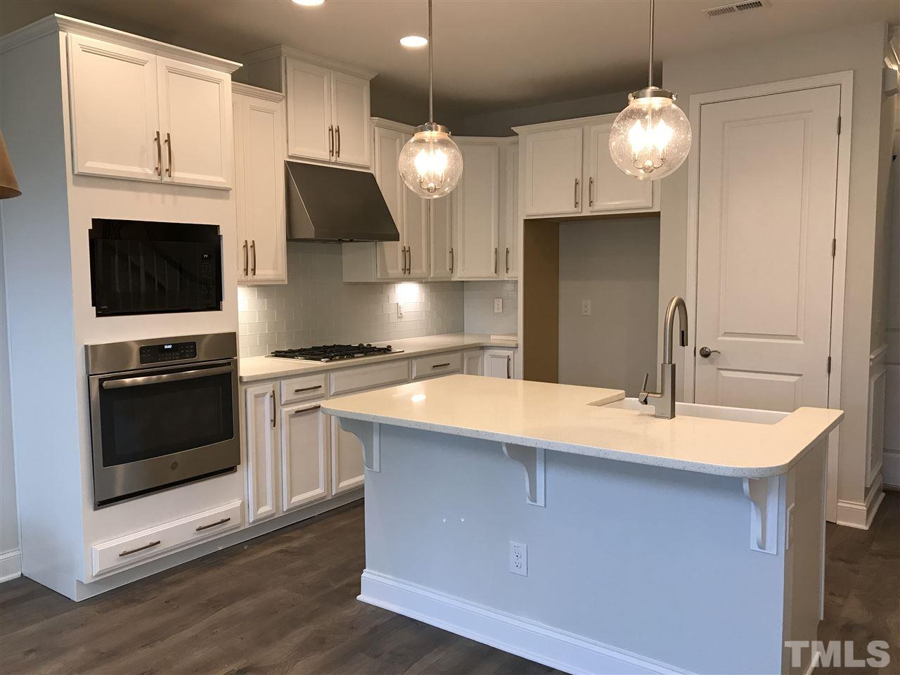 2506 Rambling Creek Road, Unit 32 Apex, NC 27523 - Photo 4 of 30 Beautiful gourmet kitchen with quartz countertops