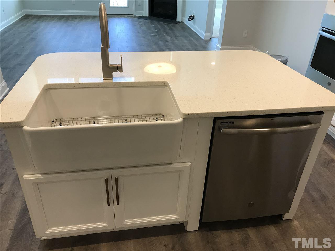 2506 Rambling Creek Road, Unit 32 Apex, NC 27523 - Photo 5 of 30 Kitchen island with a farmhouse sink