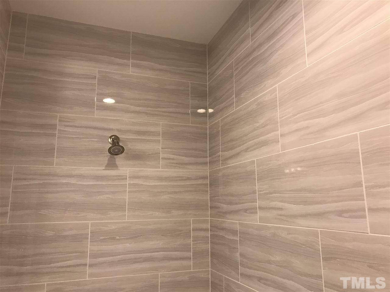 2506 Rambling Creek Road, Unit 32 Apex, NC 27523 - Photo 10 of 30 Huge walk-in shower with ceramic tile walls and floor