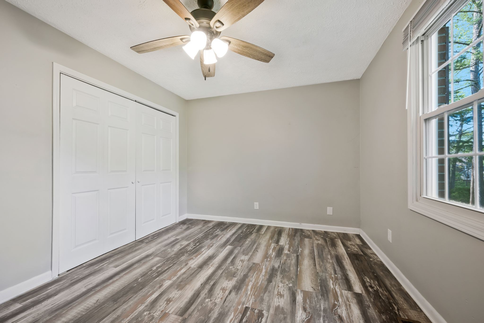 7706 Chester Road Fairview, TN 37062 - Photo 17 of 22 wooden floor in an empty room with a window