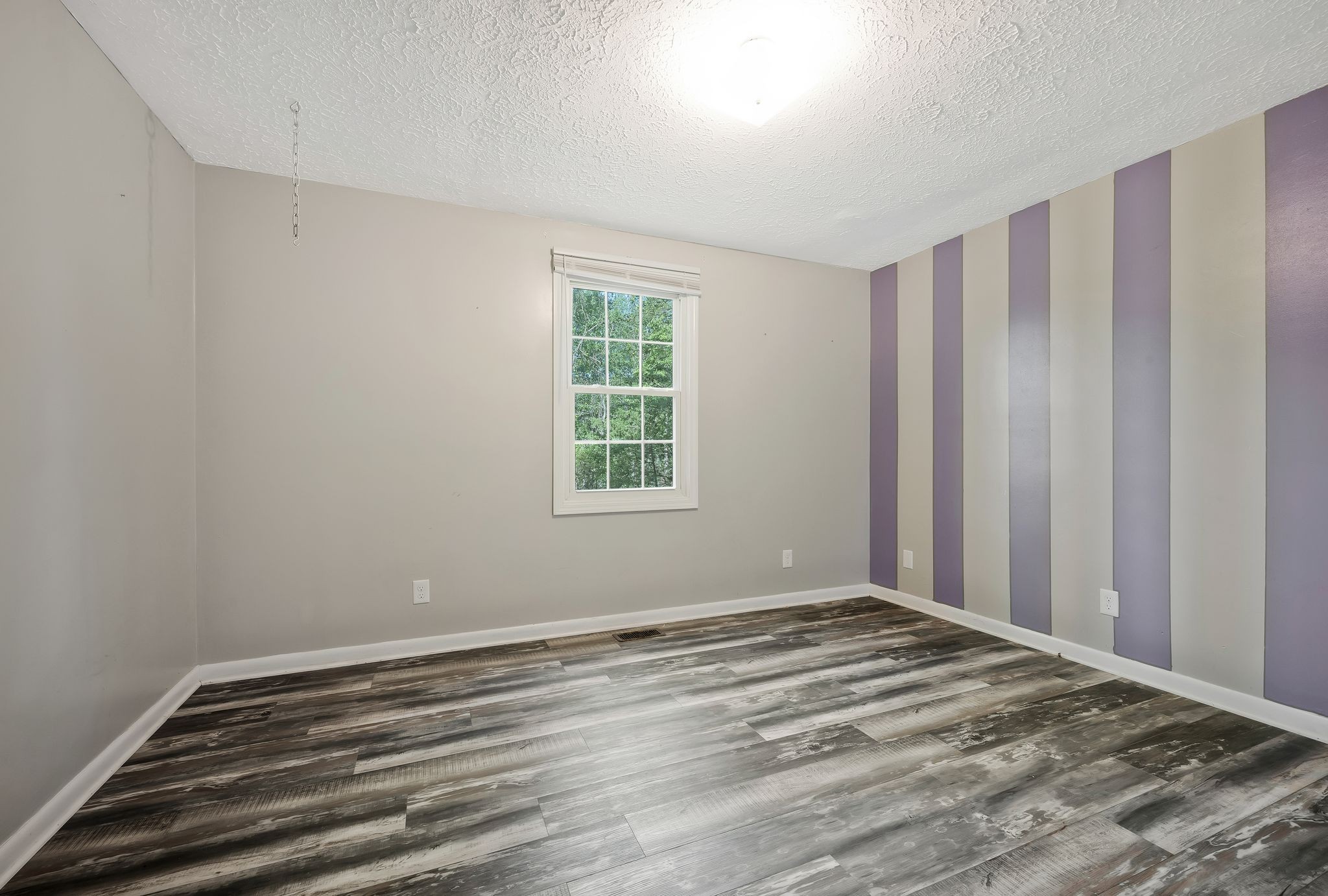 7706 Chester Road Fairview, TN 37062 - Photo 18 of 22 a view of a room with wooden floor and closet