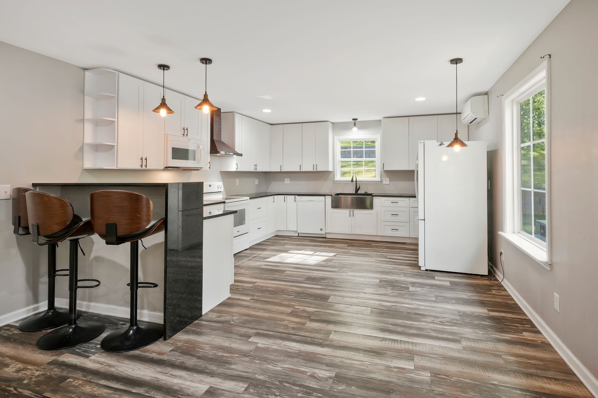 7706 Chester Road Fairview, TN 37062 - Photo 5 of 22 a view of kitchen with cabinets and wooden floor