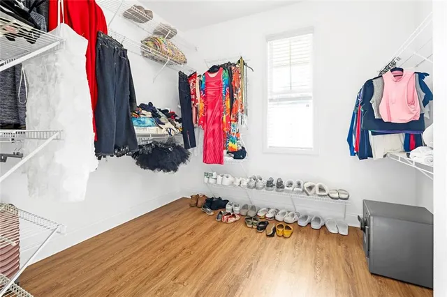 a bathroom with a tub sink mirror and vanity
