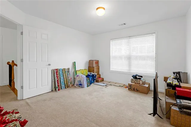 a bedroom with furniture and a window