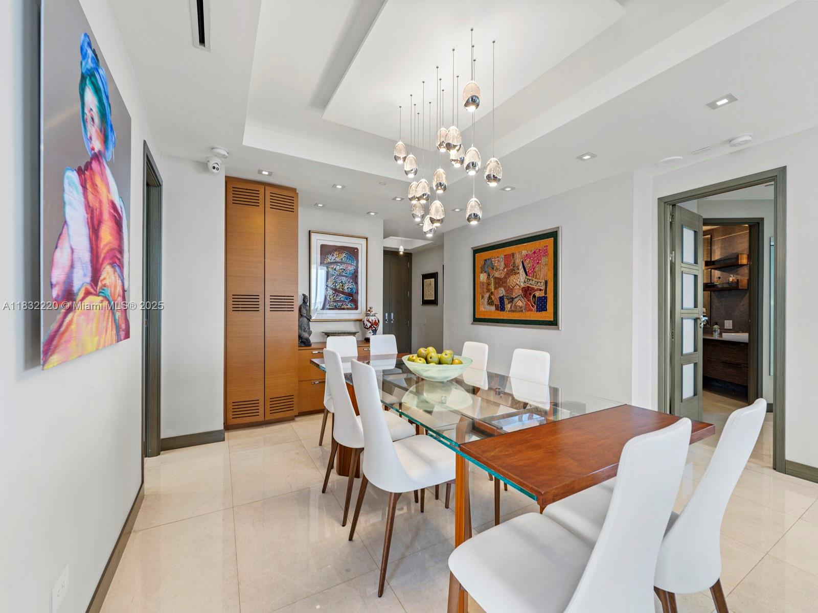 808 Brickell Key Drive, Unit 3208 Miami, FL 33131 - Photo 14 of 45 a view of a dining room with furniture