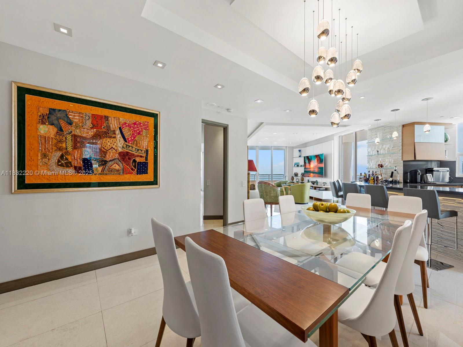808 Brickell Key Drive, Unit 3208 Miami, FL 33131 - Photo 15 of 45 a view of a dining room with furniture and wooden floor