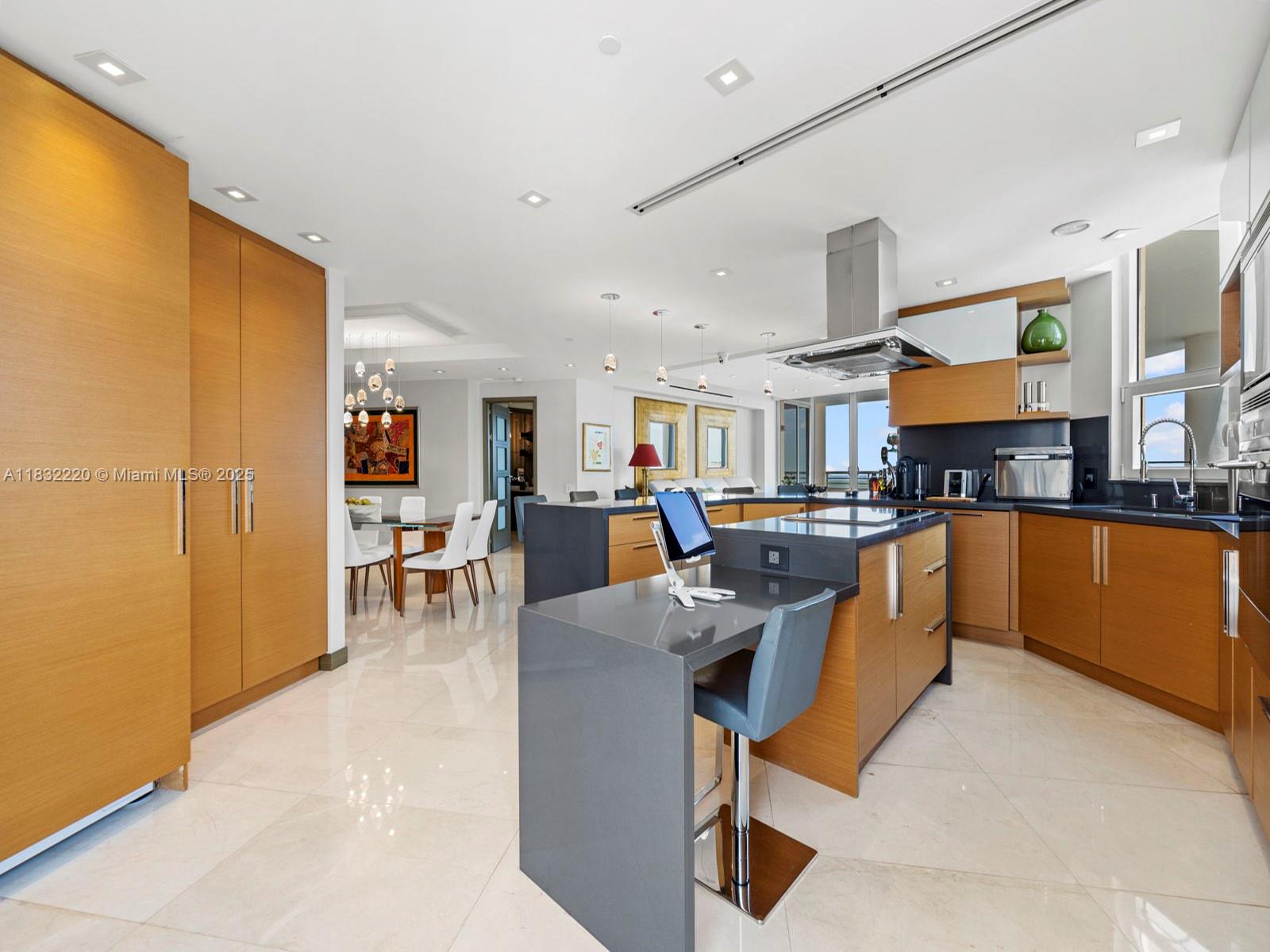 808 Brickell Key Drive, Unit 3208 Miami, FL 33131 - Photo 18 of 45 a living room with lots of furniture and kitchen view