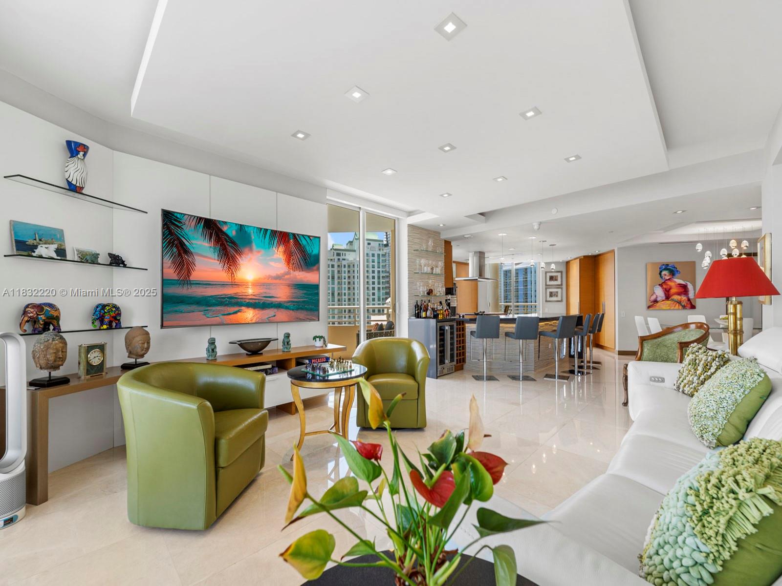 808 Brickell Key Drive, Unit 3208 Miami, FL 33131 - Photo 26 of 45 a living room with furniture and a flat screen tv