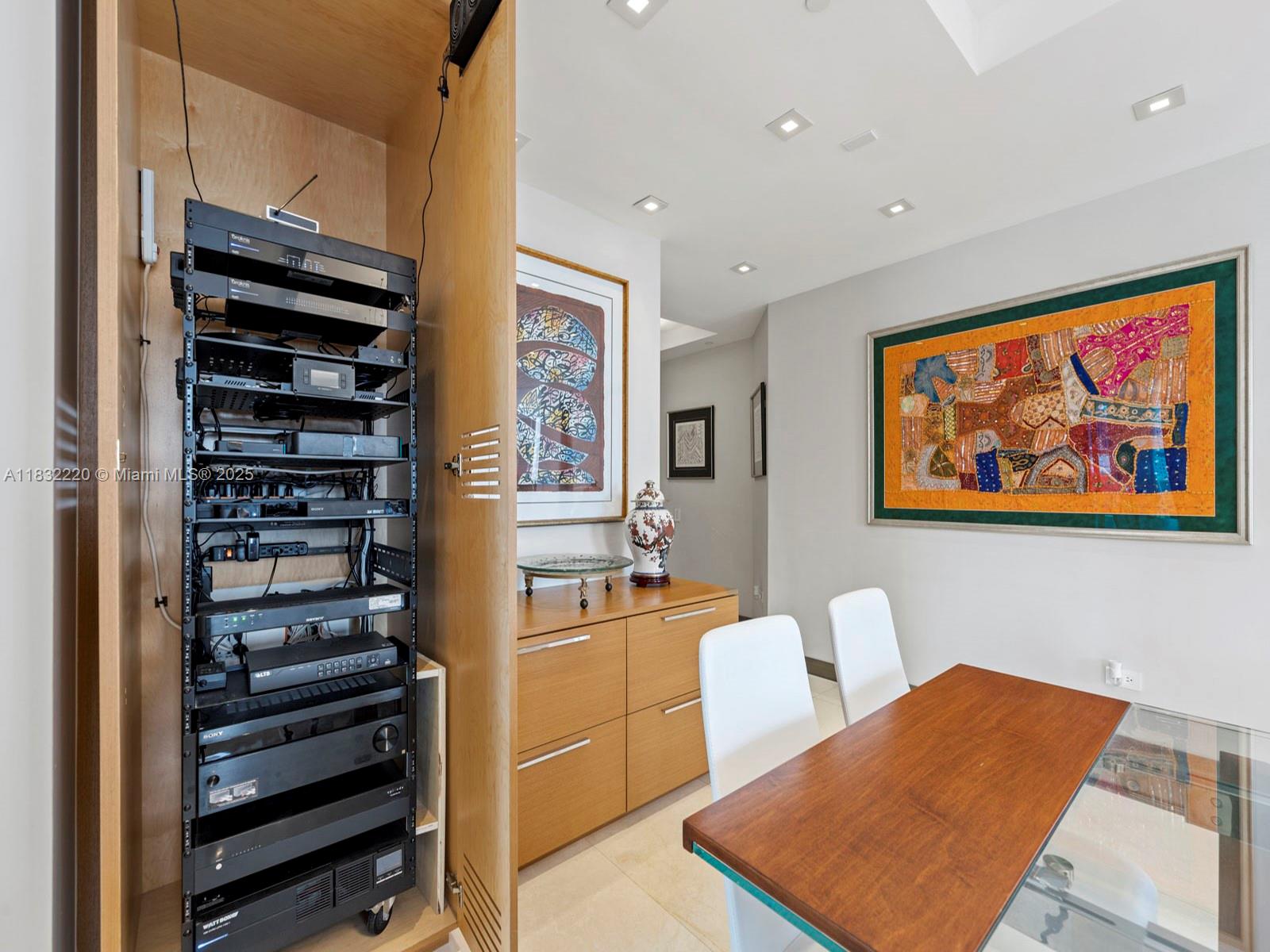 808 Brickell Key Drive, Unit 3208 Miami, FL 33131 - Photo 27 of 45 a bedroom with furniture and wooden floor