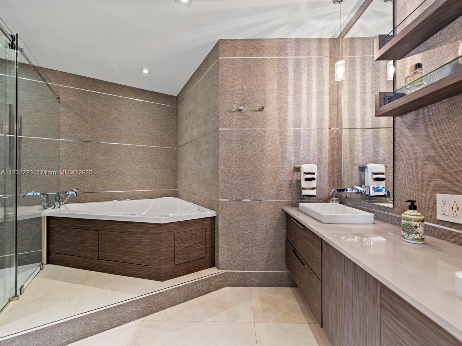 808 Brickell Key Drive, Unit 3208 Miami, FL 33131 - Photo 37 of 45 a bathroom with a sink and a mirror