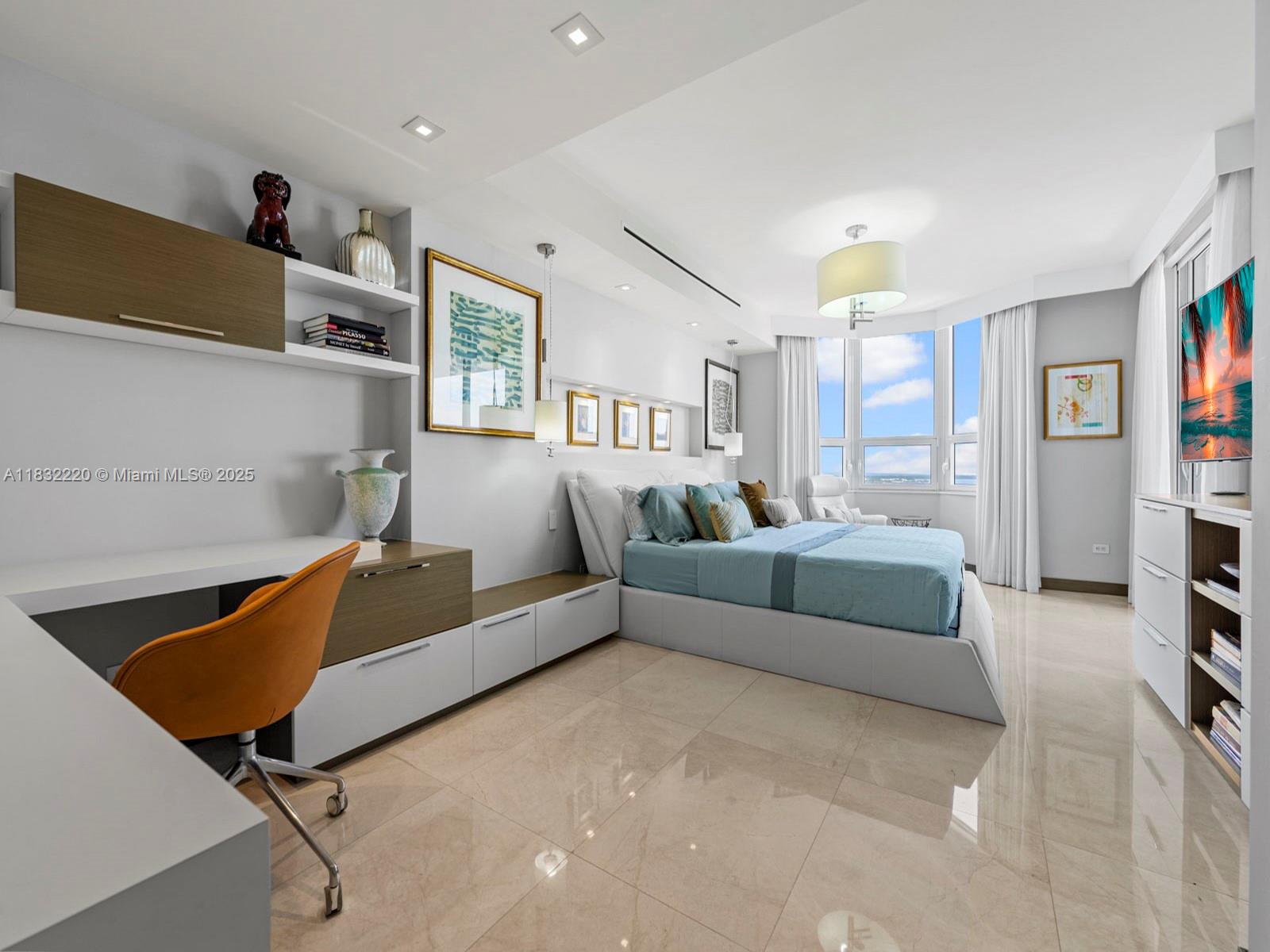 808 Brickell Key Drive, Unit 3208 Miami, FL 33131 - Photo 40 of 45 a living room with furniture and a flat screen tv