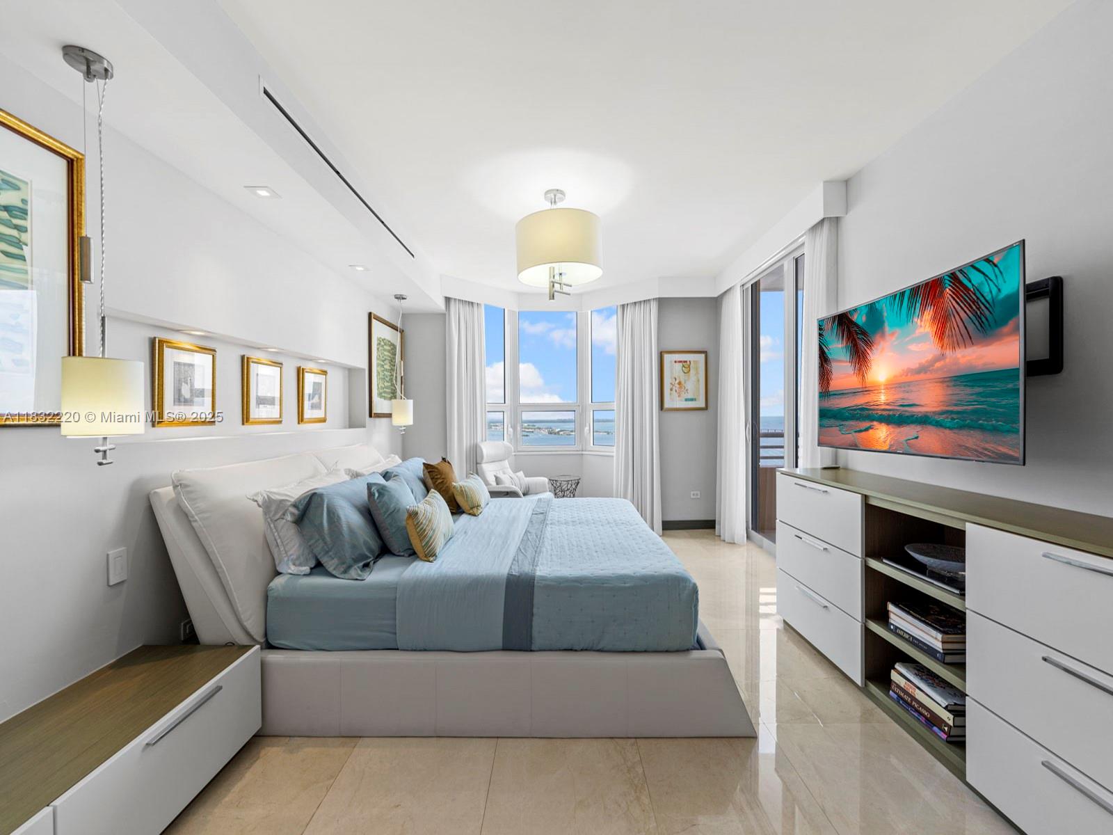 808 Brickell Key Drive, Unit 3208 Miami, FL 33131 - Photo 41 of 45 a living room with furniture and a flat screen tv